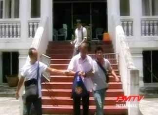 Once disrobed the ex monk is escorted to the police station.